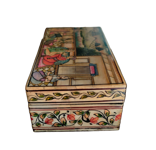 Lid of Mughal miniature bone and wood box showing hand-painted women musicians and courtiers in landscape