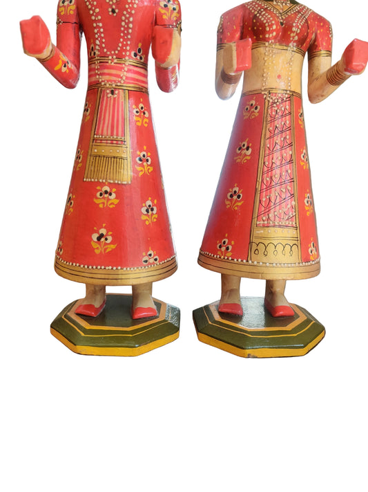 Rajasthani bride and groom wooden figurines in vivid red with floral motifs