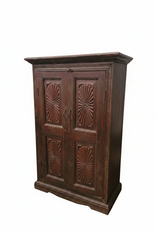 Close-up of hand-carved sunburst pattern on vintage Indian wooden cabinet — Timeless Treasures collection