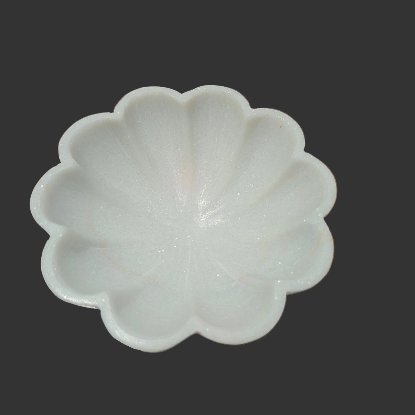White marble flower bowl close up hand-carved petal ridges Rajasthan