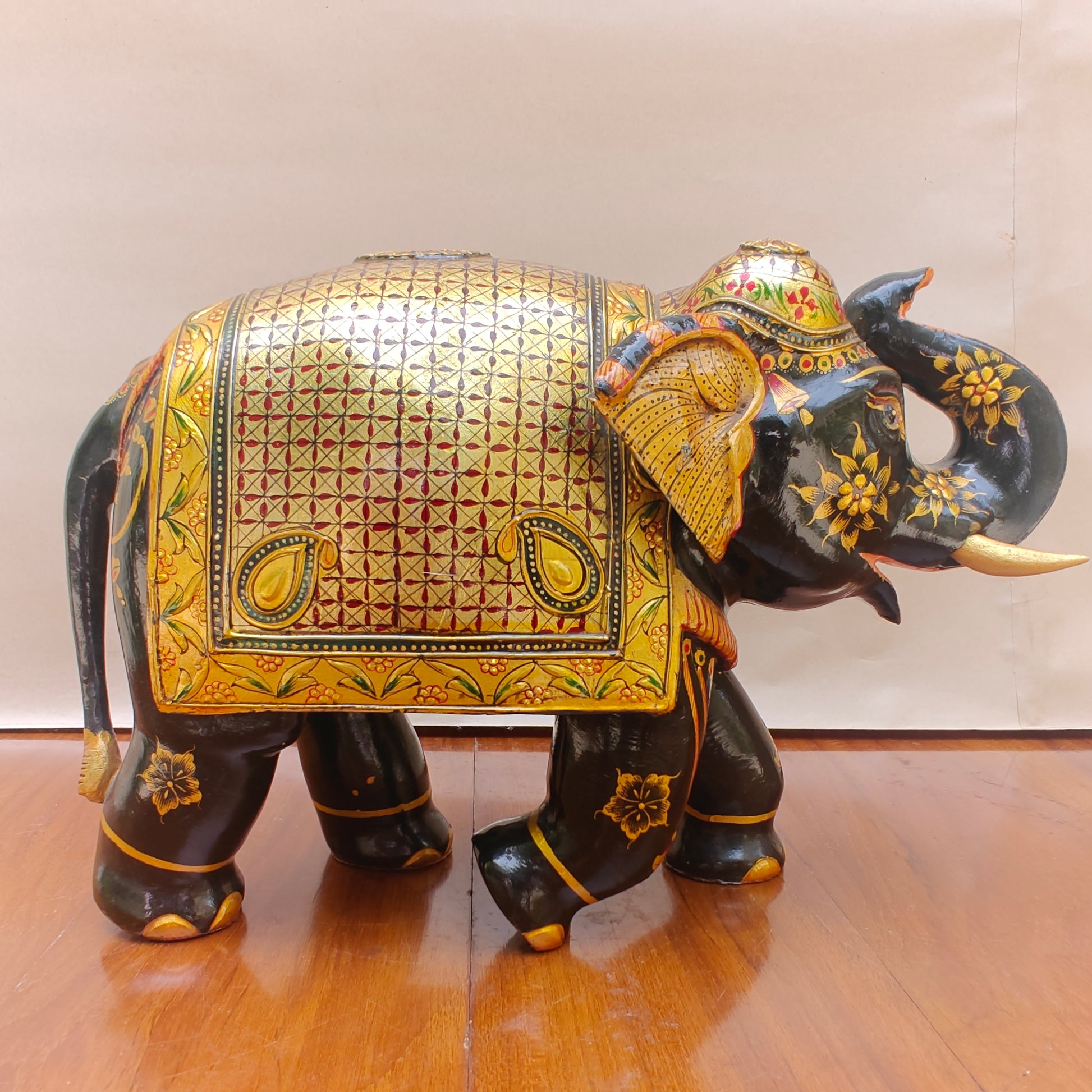 Back view of handpainted black and gold elephant home decor piece