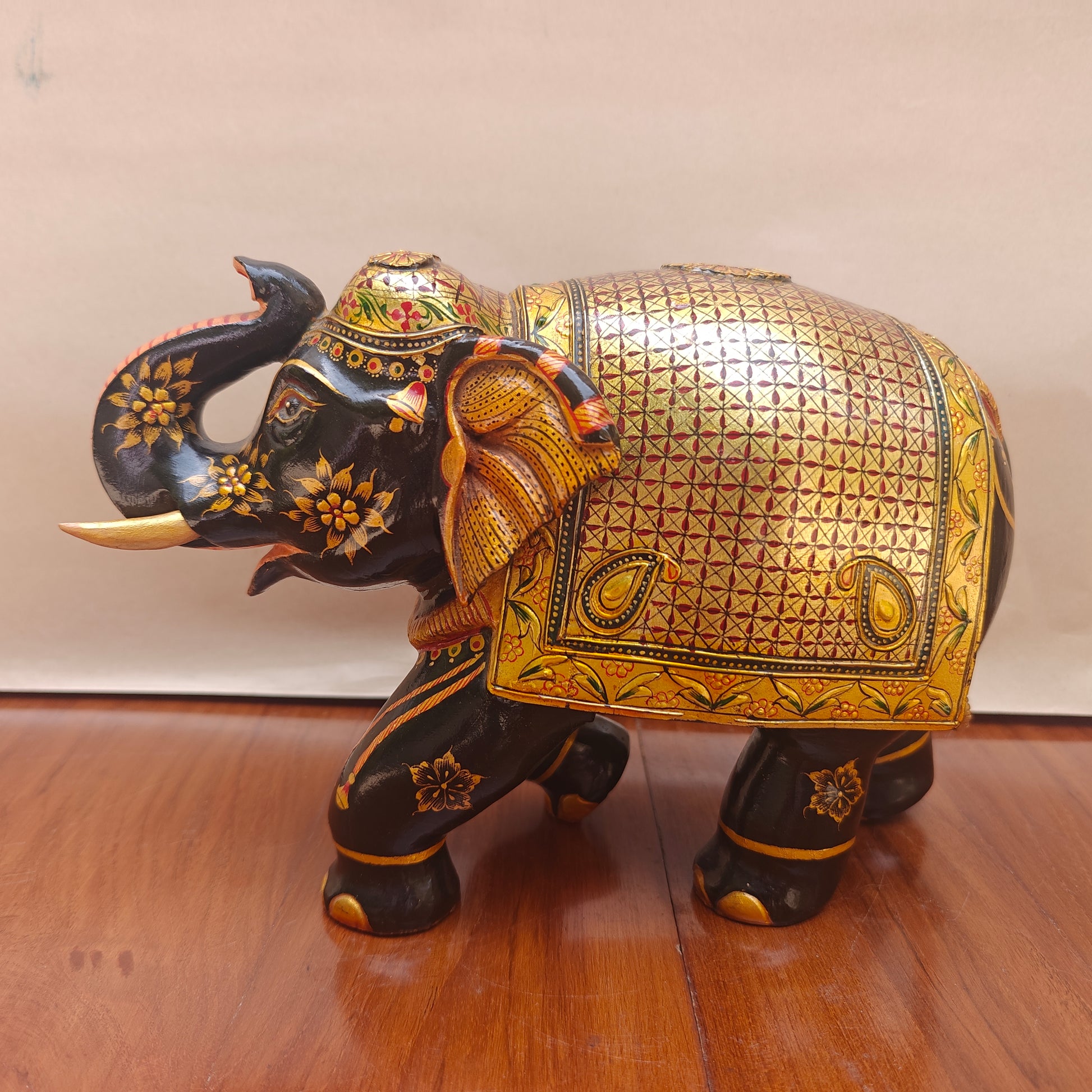 Handpainted black and gold elephant decor – side view showing detailing