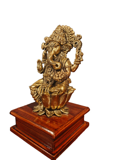 Detail of ornate base and backdrop pattern on brass Ganesha statue