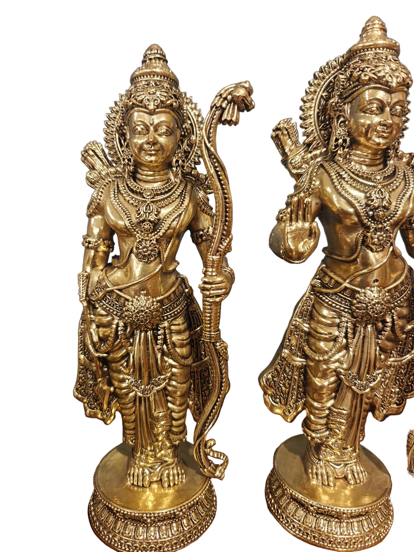 Angled view of brass Ram Darbar idol set displayed on wooden surface