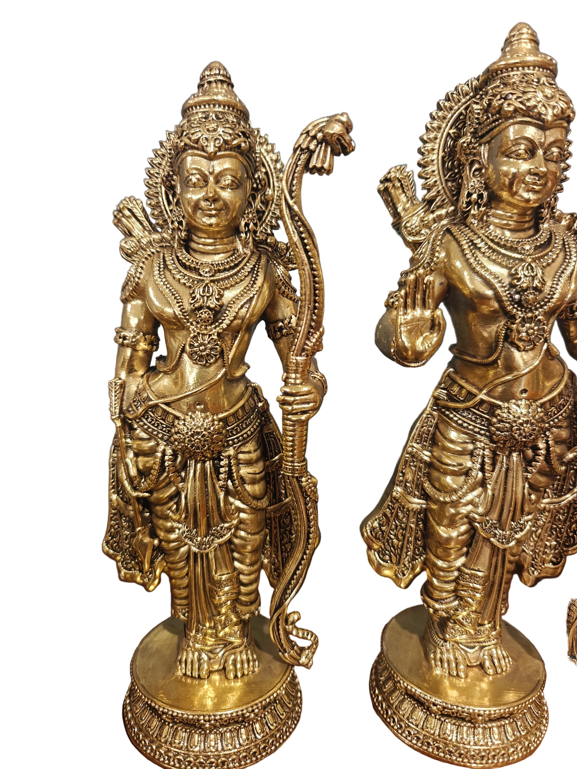 Angled view of brass Ram Darbar idol set displayed on wooden surface