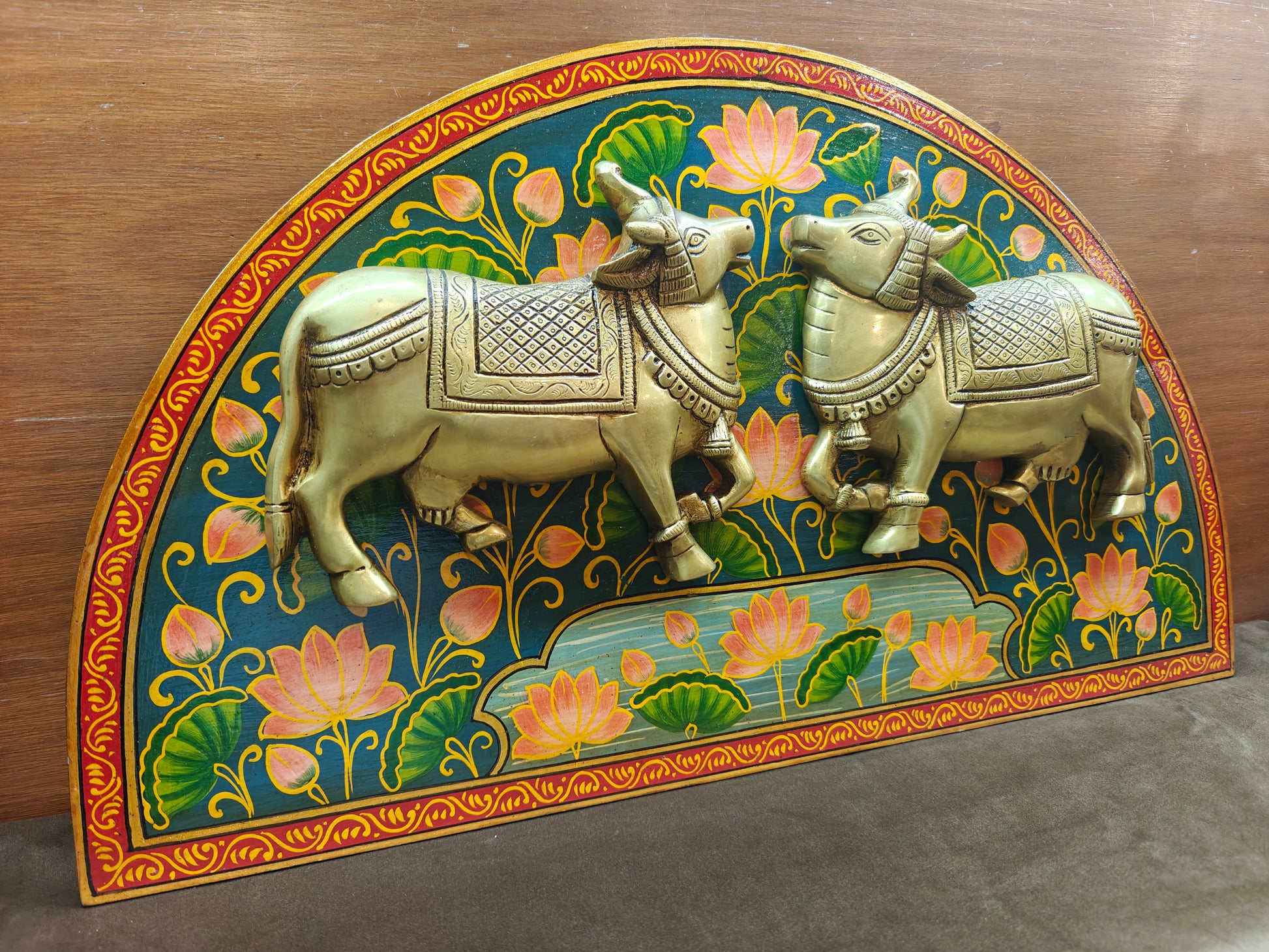 Back view of brass sacred cow wall panel showing wall-mount hardware