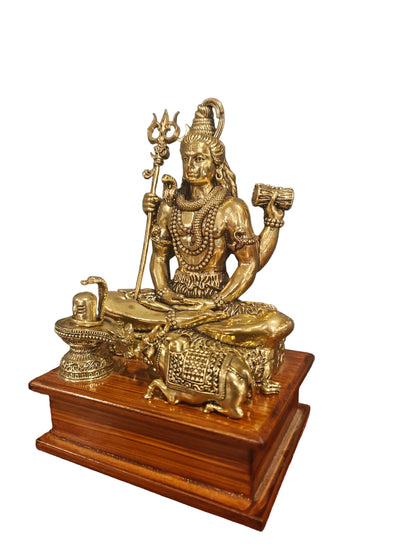 Angled view of brass Shiva with Nandi statue on wooden stand