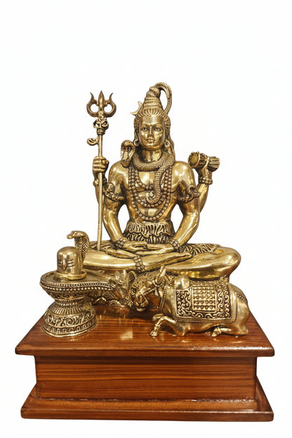 Brass Shiva idol with Nandi and Shiva lingam on wooden stand, front view