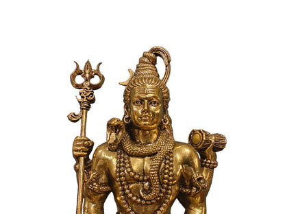 Brass Shiva with Nandi on wooden stand styled on wooden surface with decor accessories
