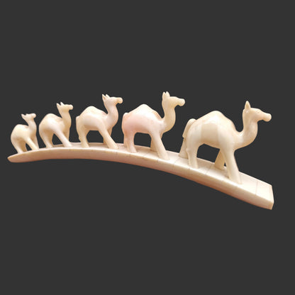 Detail view of carved bone camel parade decor piece