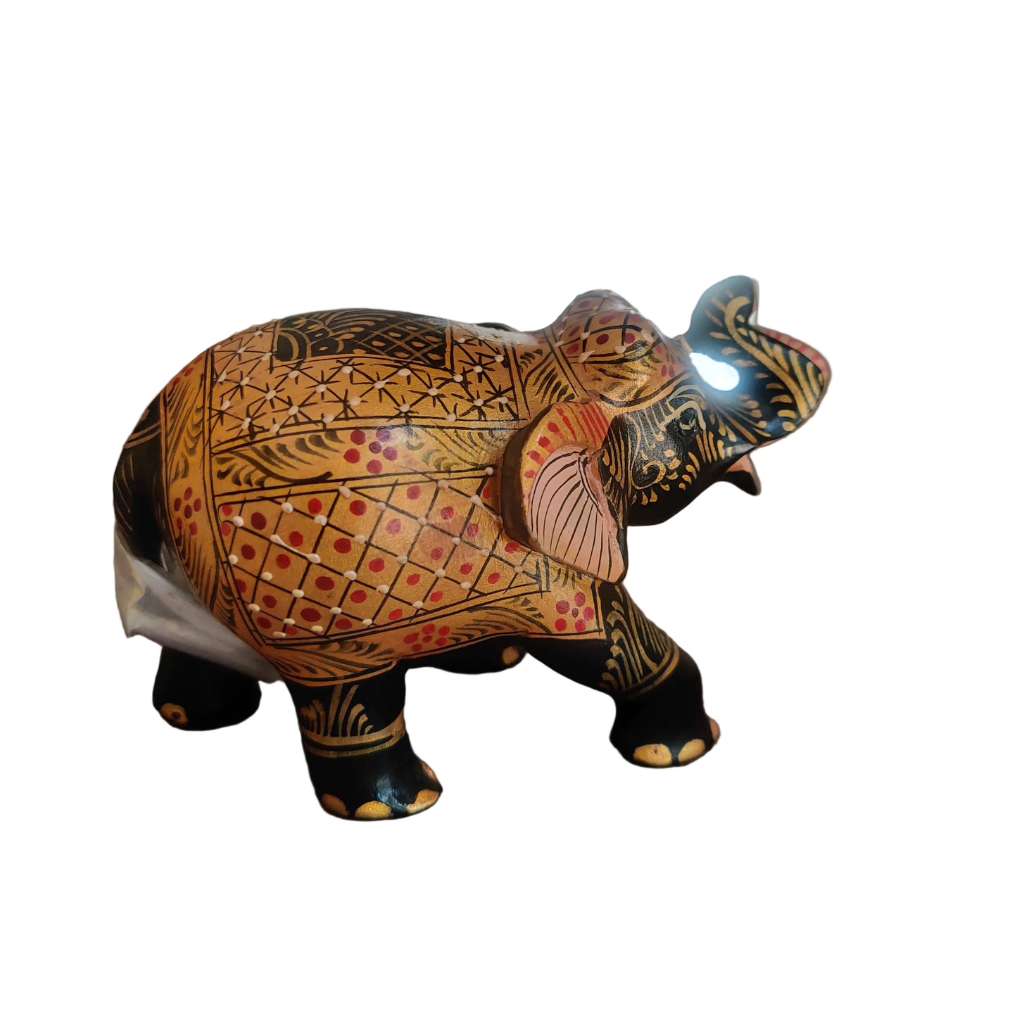 Side view of hand-painted wooden elephant with geometric and floral motifs