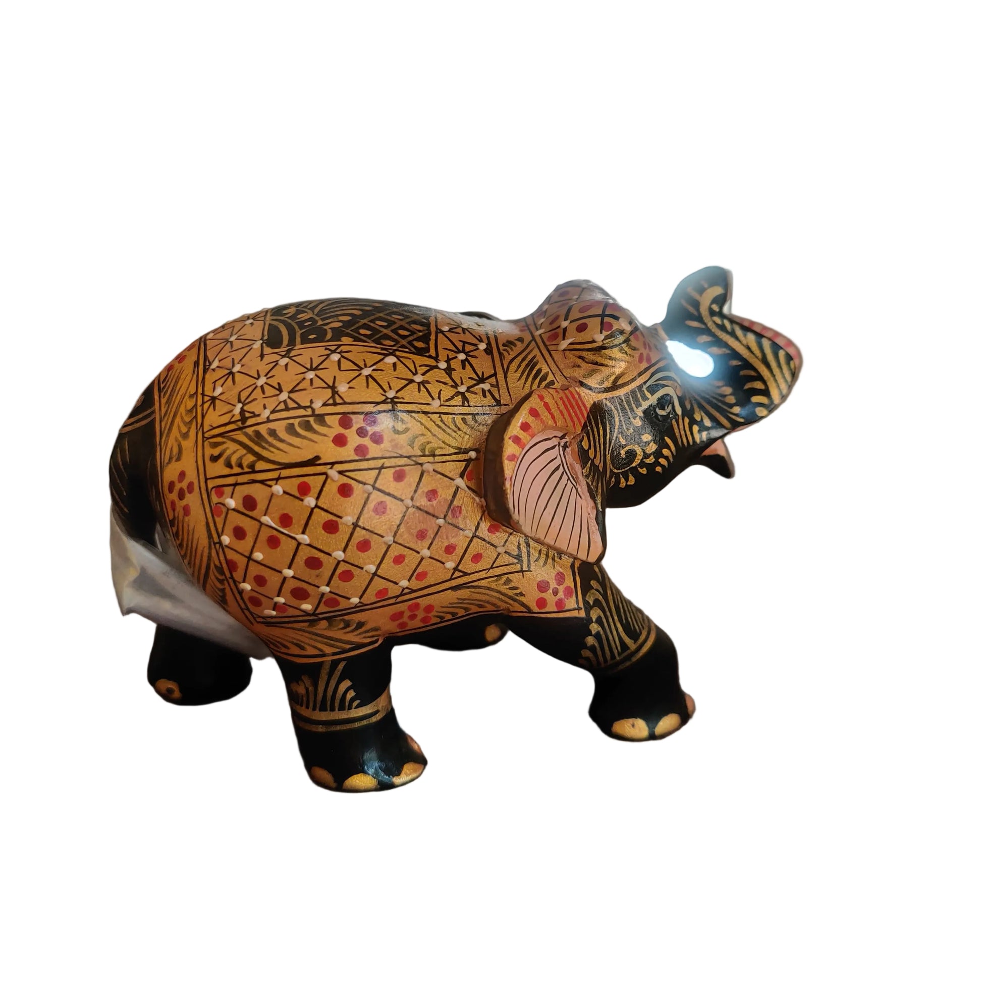 Side view of hand-painted wooden elephant with geometric and floral motifs