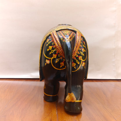 Close-up of floral handpainted pattern on black elephant figurine