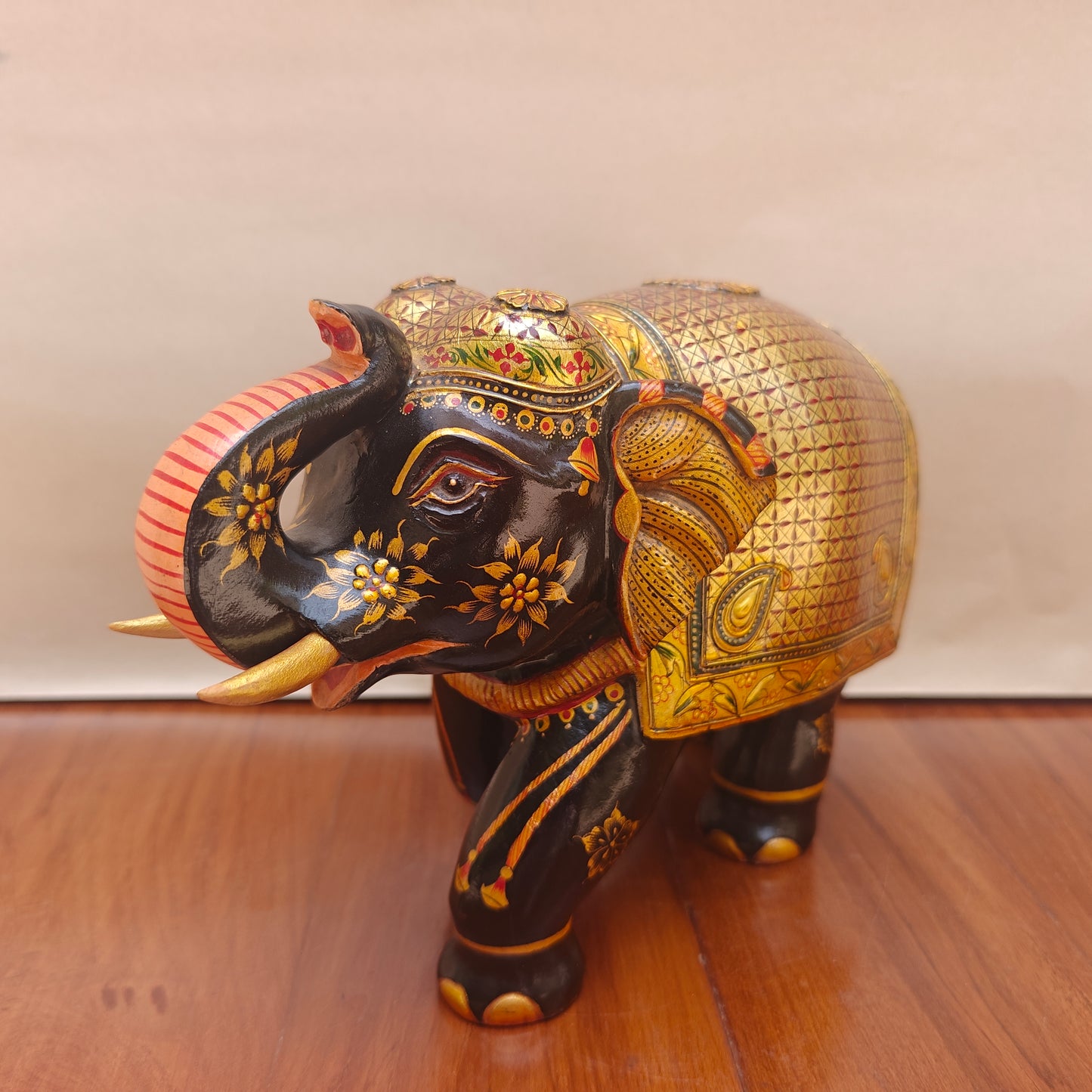 Handpainted black and gold elephant figurine – front view