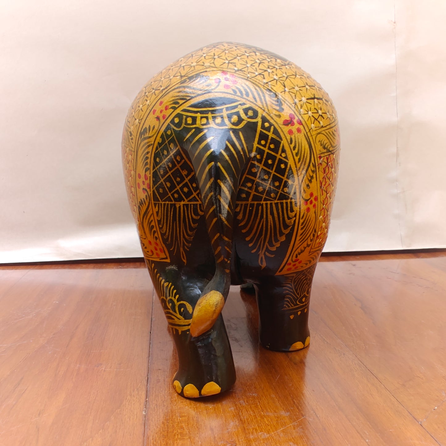  Back view of black and ochre handpainted elephant home decor figurine