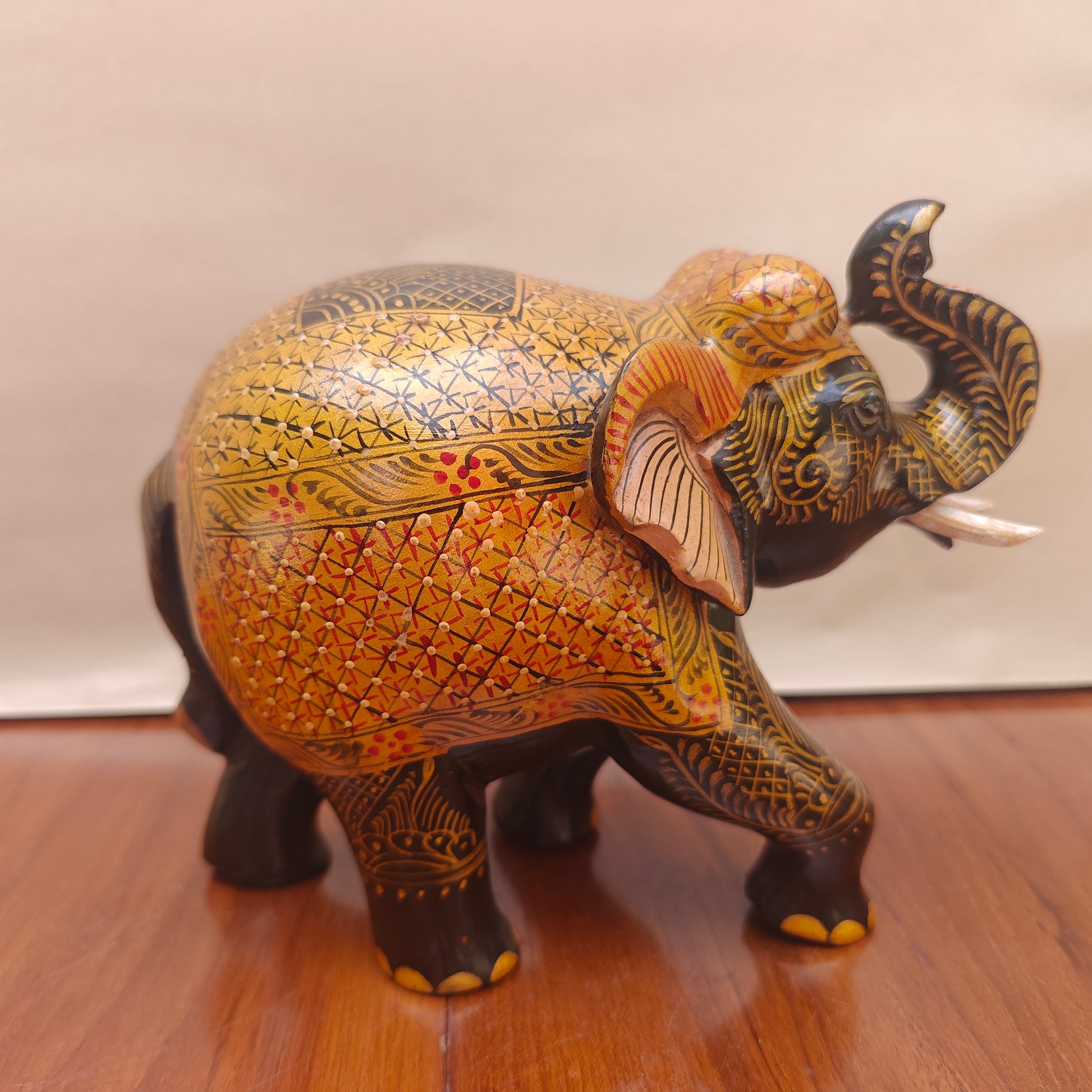  Back view of black and ochre handpainted elephant home decor figurine
