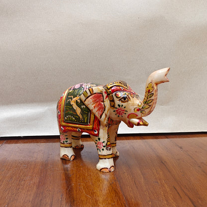 Handpainted mini bone elephant figurine with colourful traditional artwork – front side view
