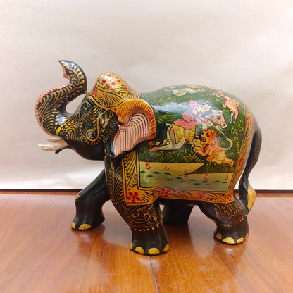 Close-up of intricate miniature-style artwork on handpainted elephant figurine