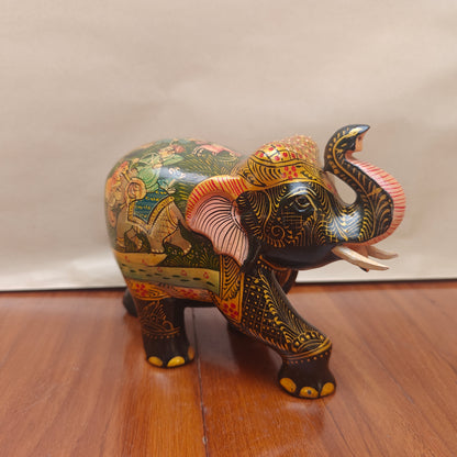 Handpainted storytelling elephant figurine with miniature-style artwork – front side view