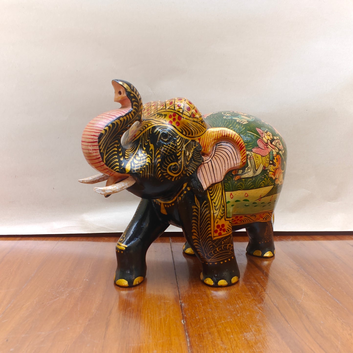  Detail of patterned head, ears and tusks on handpainted storytelling elephant decor piece