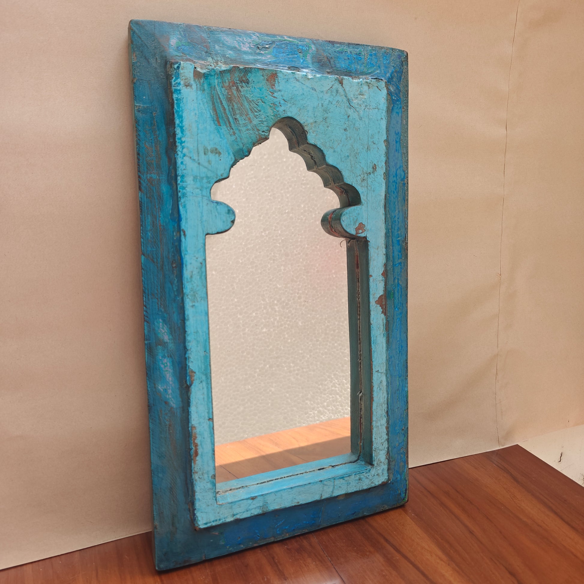 Distressed turquoise blue wood Jharokha mirror frame with arched mihrab design front angle