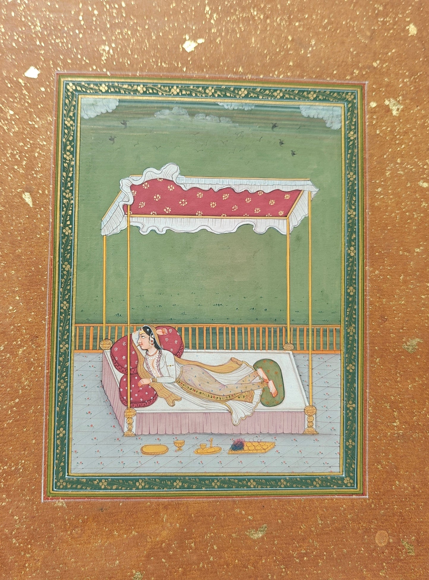 Angled view of Lady on Bed in the Terrace miniature painting on paper showing border and texture