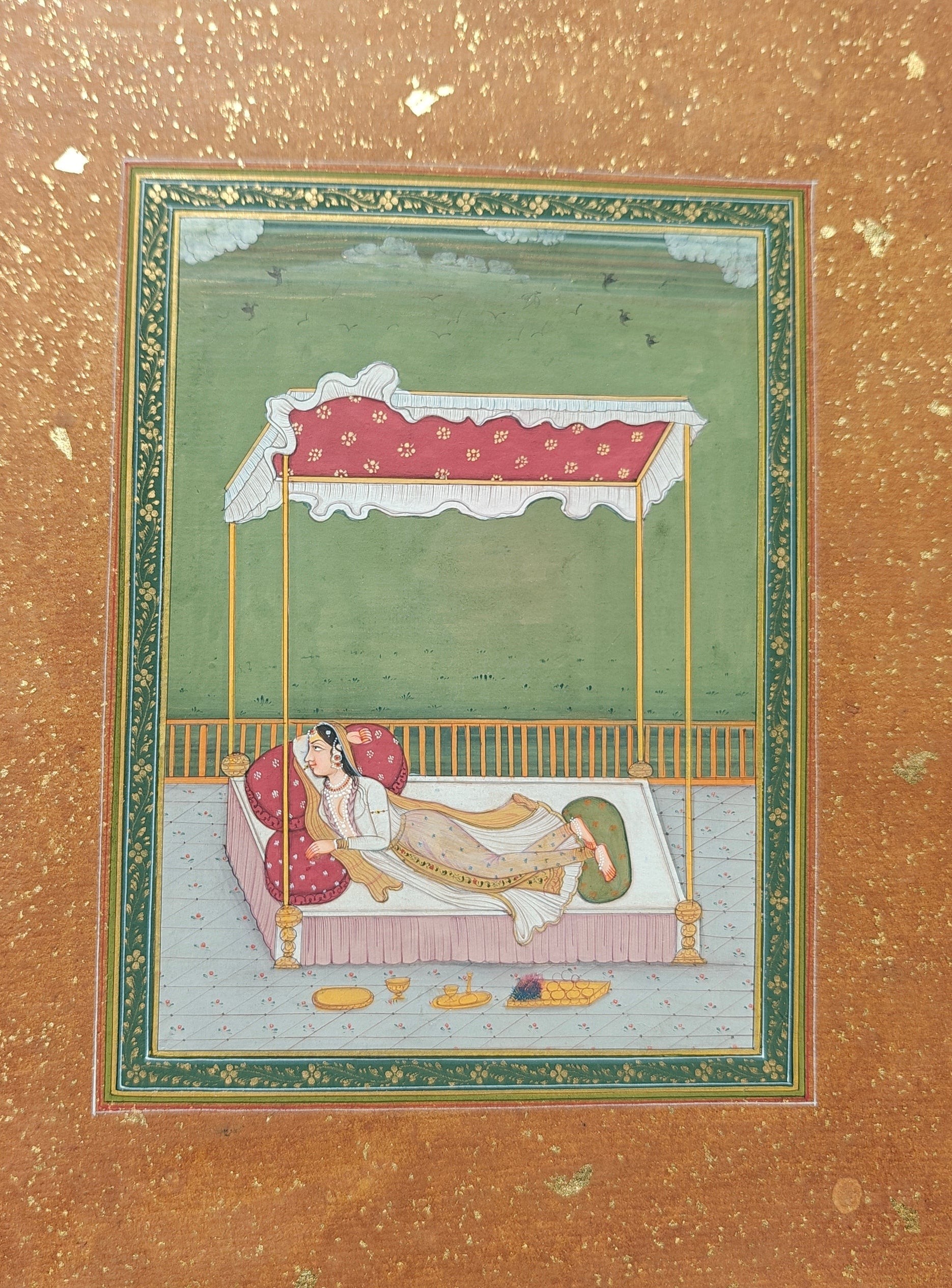 Angled view of Lady on Bed in the Terrace miniature painting on paper showing border and texture