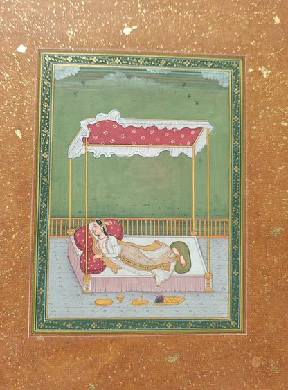 Angled view of Lady on Bed in the Terrace miniature painting on paper showing border and texture