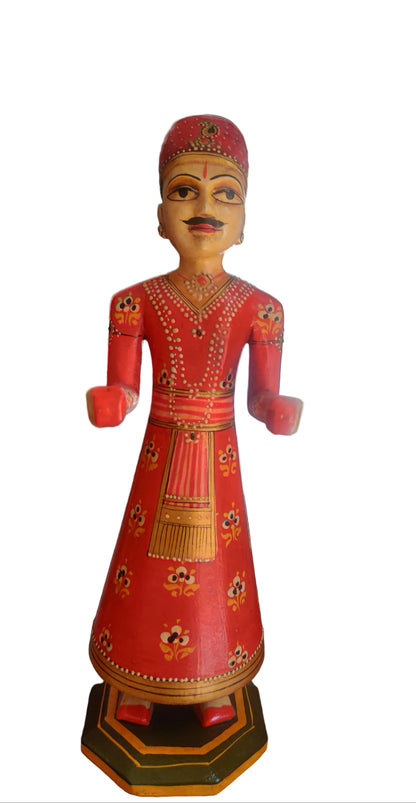 Rajasthani bride and groom wooden figurines in vivid red with floral motifs.