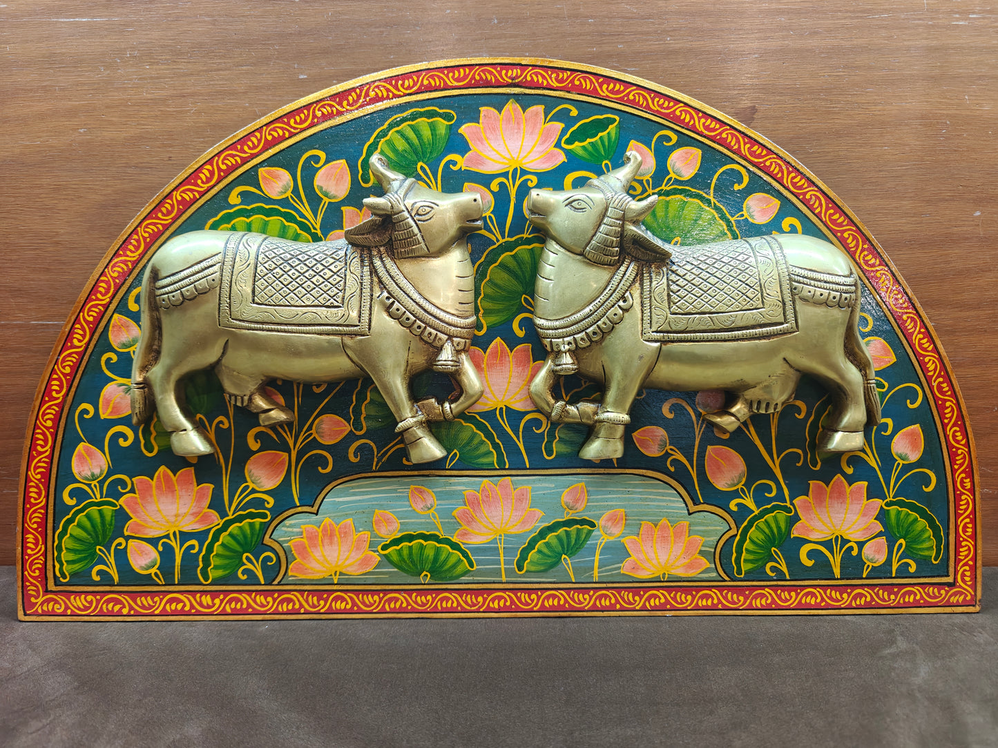 Brass sacred cow wall panel styled above a console table