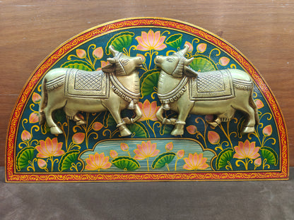 Brass sacred cow wall panel styled above a console table
