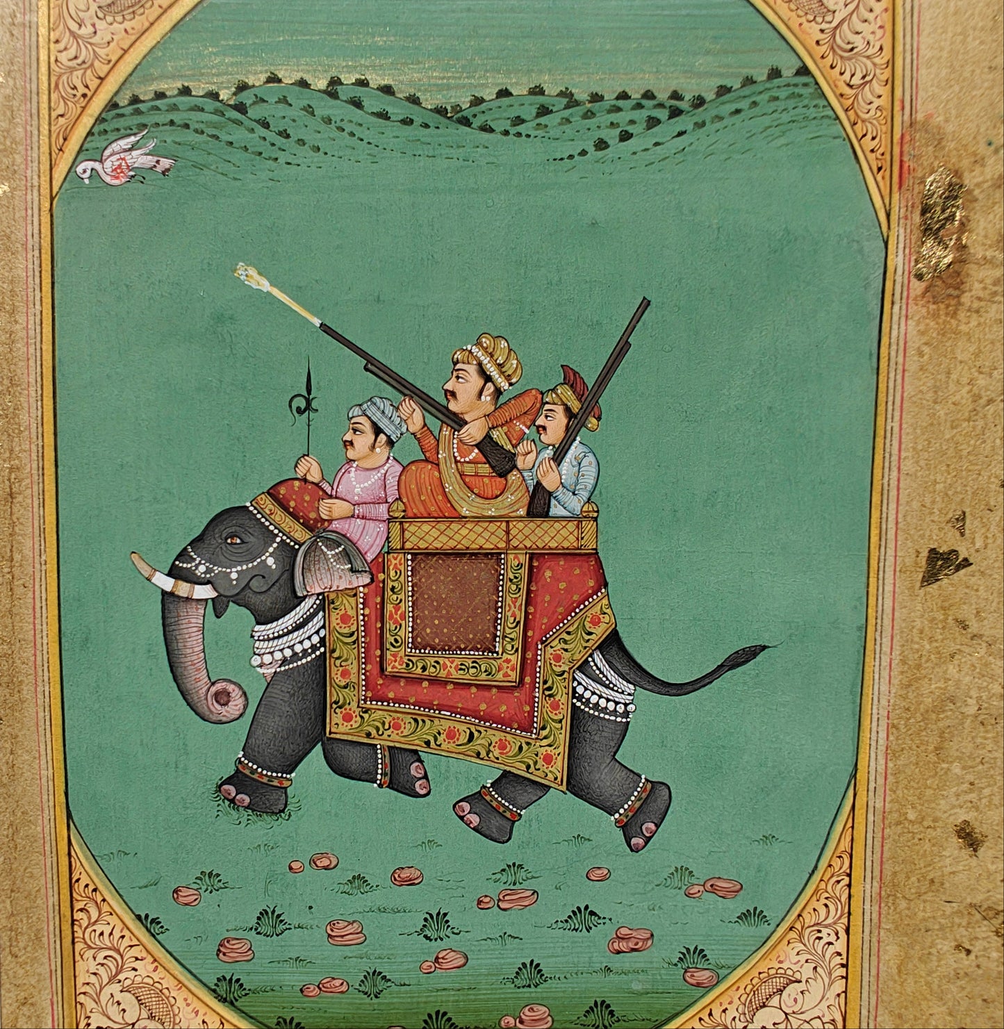Angled view of royal hunting party on elephant miniature painting showing gold-flecked mount