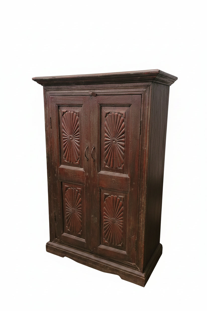 Close-up of hand-carved sunburst pattern on vintage Indian wooden cabinet — Timeless Treasures collection