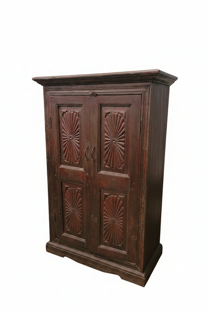 Close-up of hand-carved sunburst pattern on vintage Indian wooden cabinet — Timeless Treasures collection