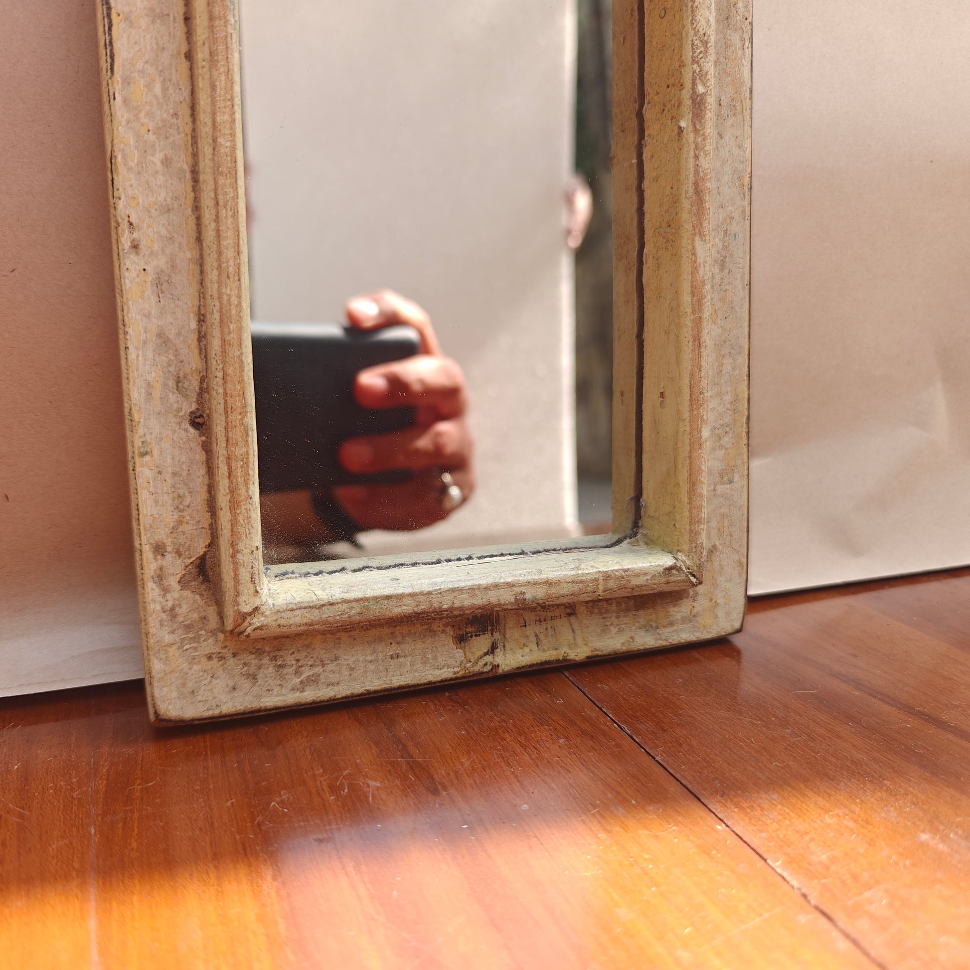 Vintage antique patina mirror styled on a console table
