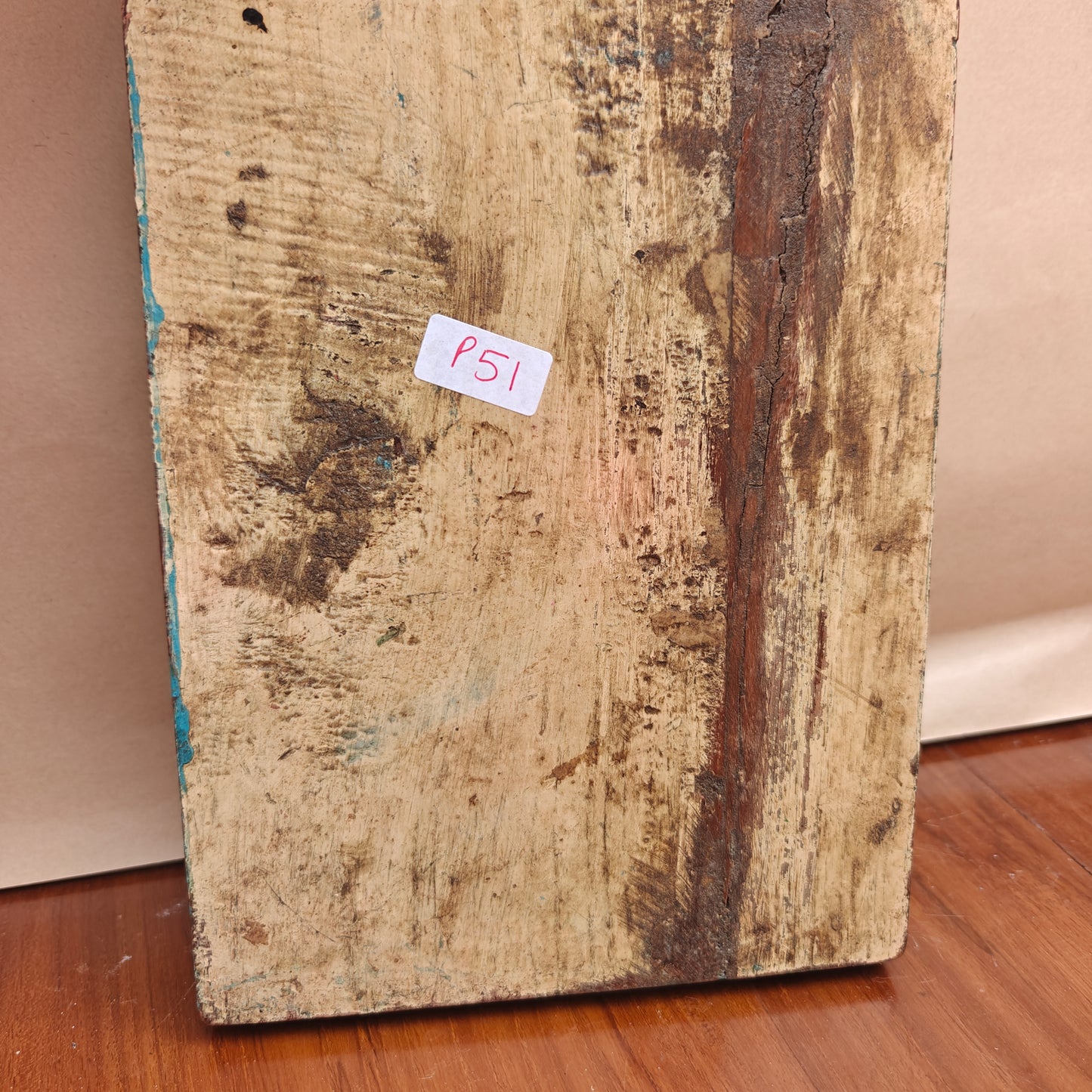 Vintage distressed blue mirror reflecting room interior