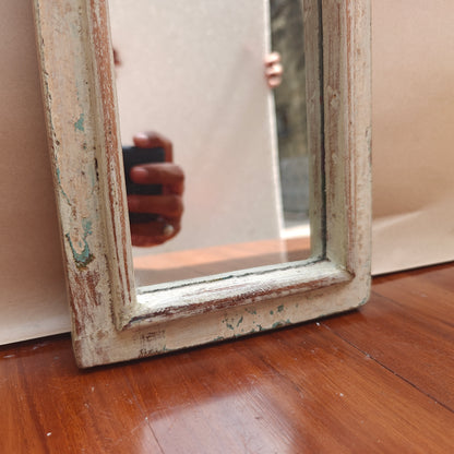 Vintage ivory crown-top mirror styled on a console table