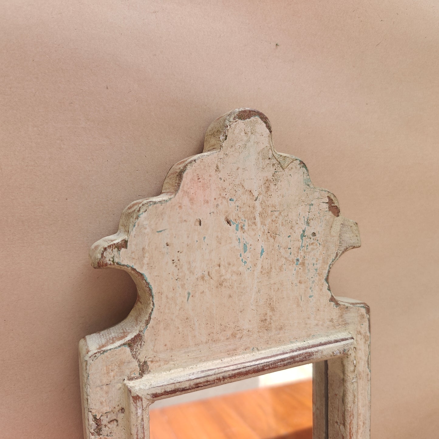 Side profile of vintage ivory crown-top mirror showing frame depth