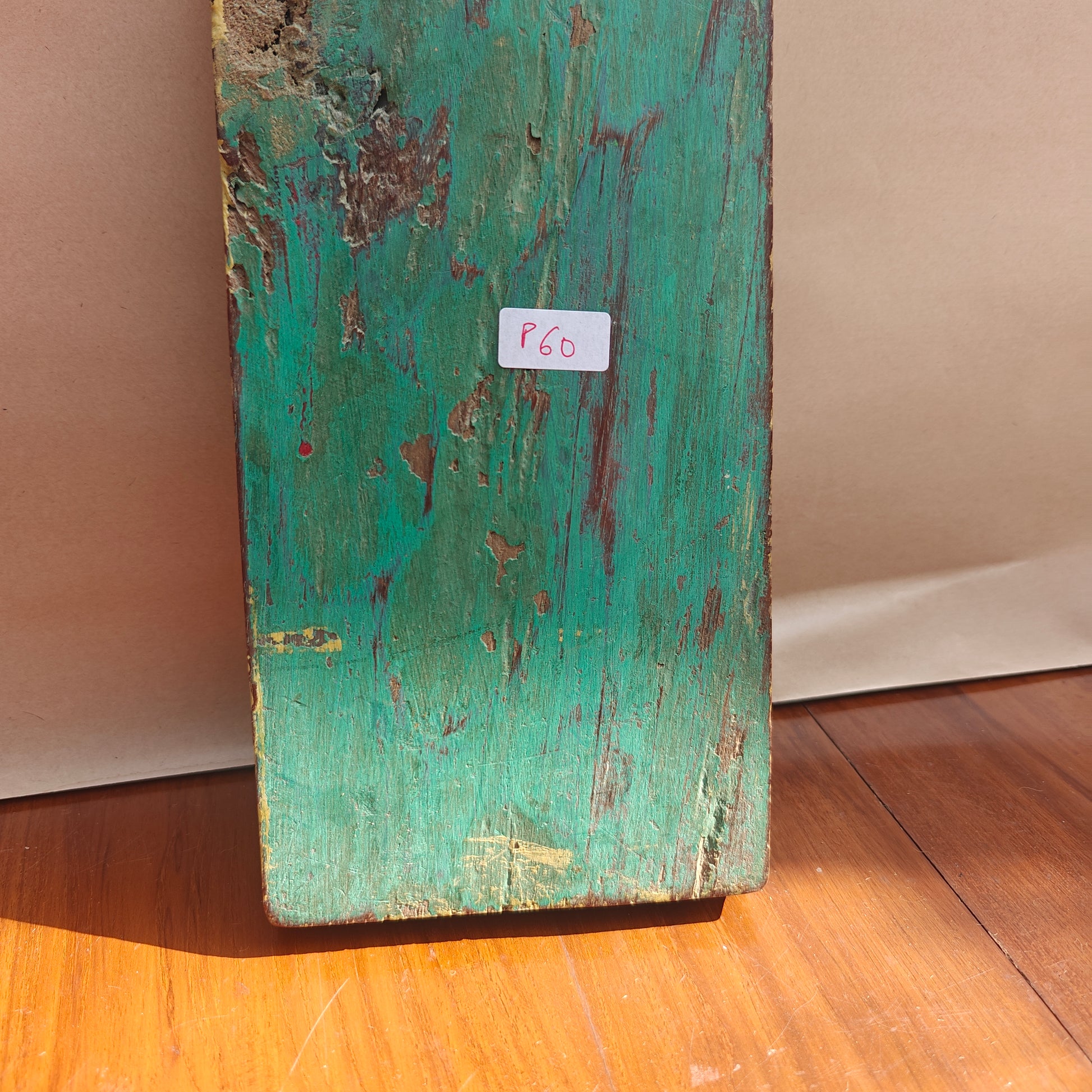 Vintage distressed mustard mirror reflecting room interior