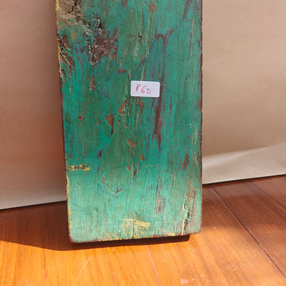 Vintage distressed mustard mirror reflecting room interior