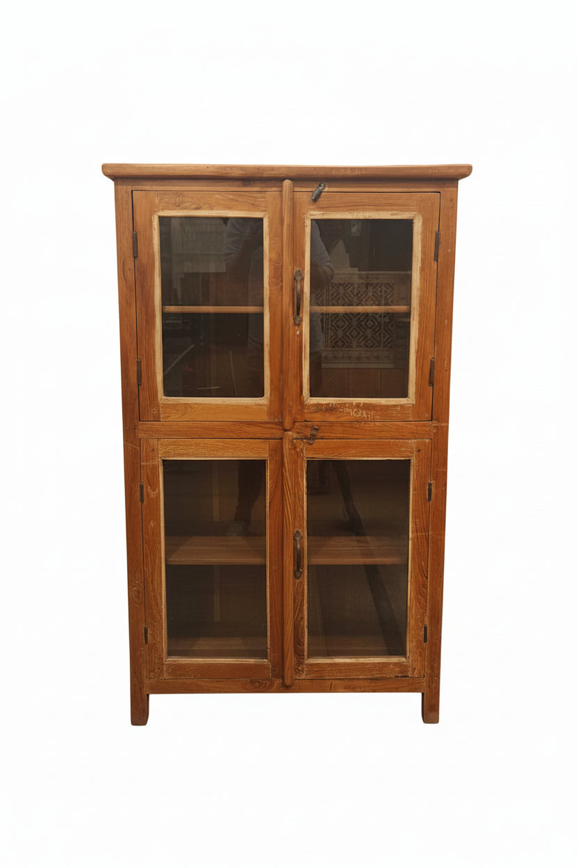 Vintage antique four-door double-tier teak glass display cabinet with iron handles and curved base — front view, Poonam Backliwal