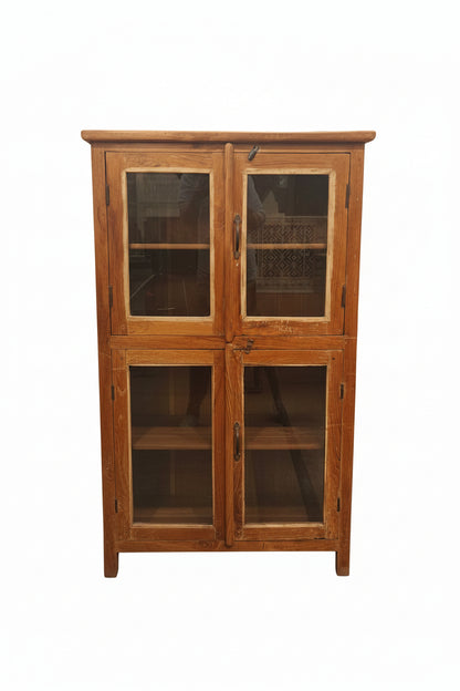 Vintage antique four-door double-tier teak glass display cabinet with iron handles and curved base — front view, Poonam Backliwal