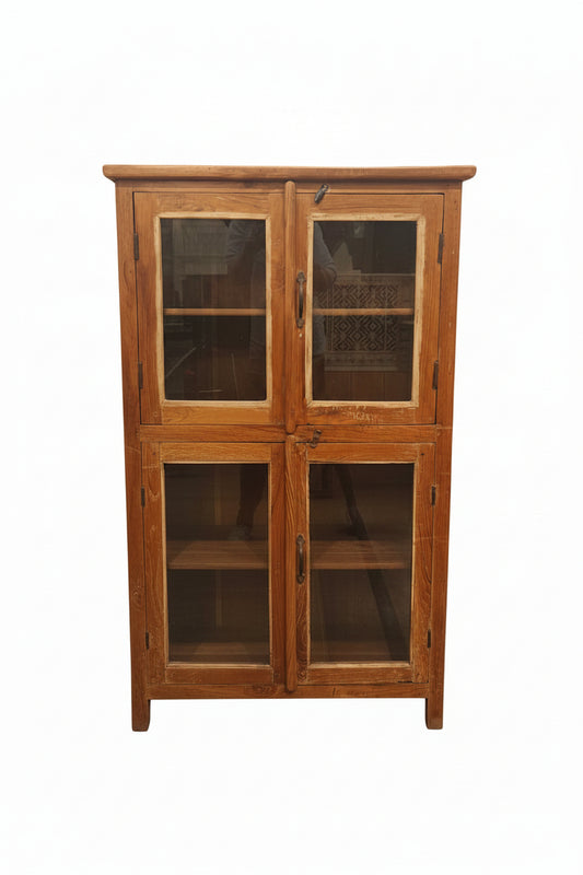 Vintage antique four-door double-tier teak glass display cabinet with iron handles and curved base — front view, Poonam Backliwal
