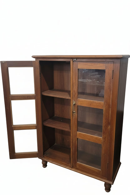 Close-up detail of vintage glass cabinet door and wood frame — Timeless Treasures collection