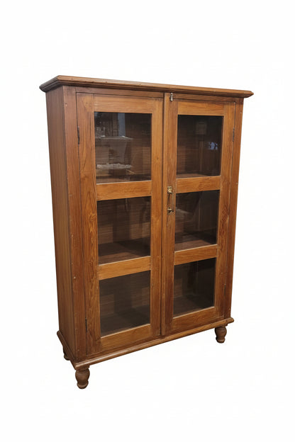 Vintage glass display cabinet with wood frame and glass-panelled doors — front view