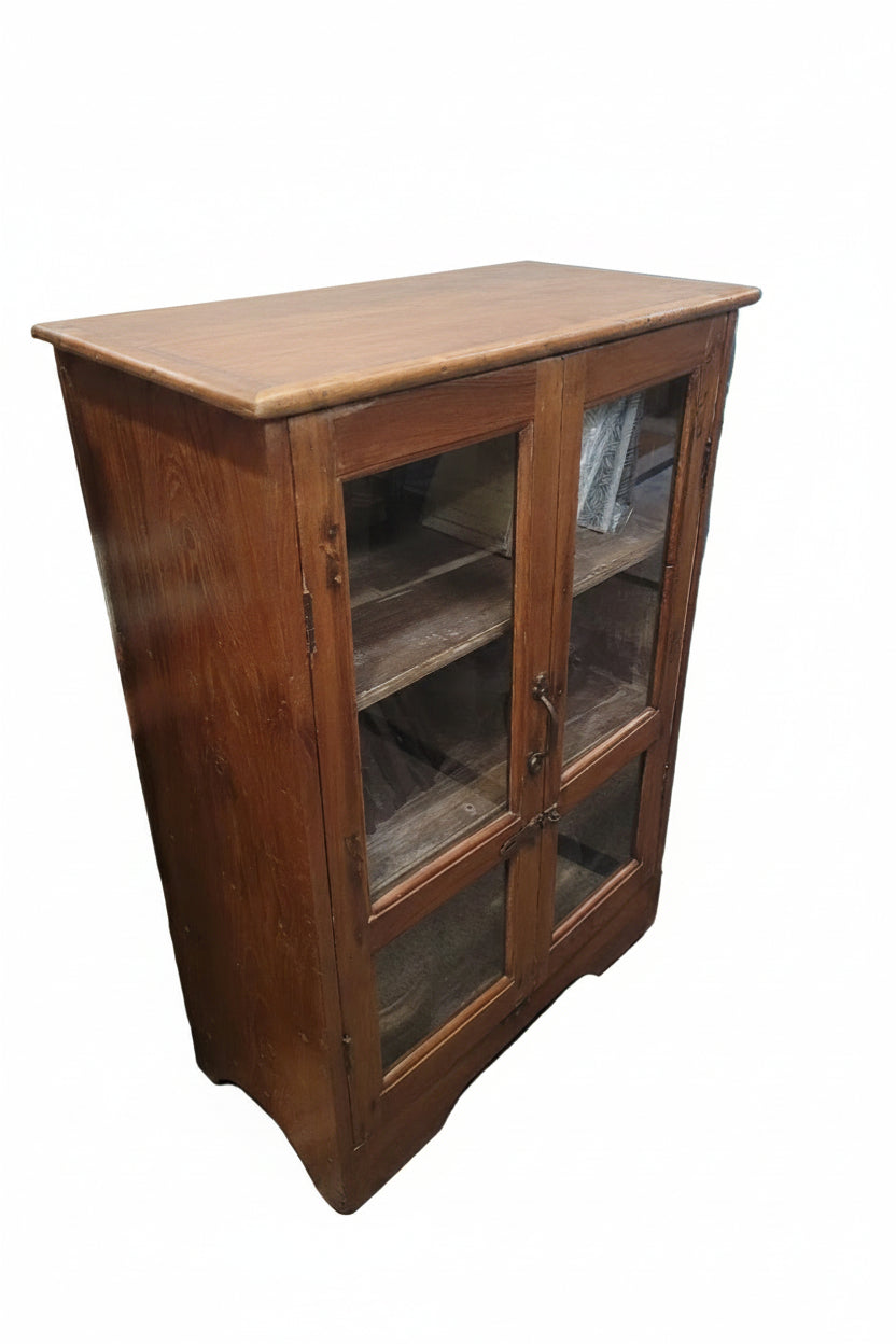 Antique Indian solid teak glass cabinet — three-quarter angle view showing warm wood grain and depth


