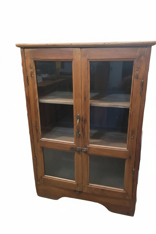 Vintage antique teak glass display cabinet with iron latch hardware and curved base — front view, Poonam Backliwal