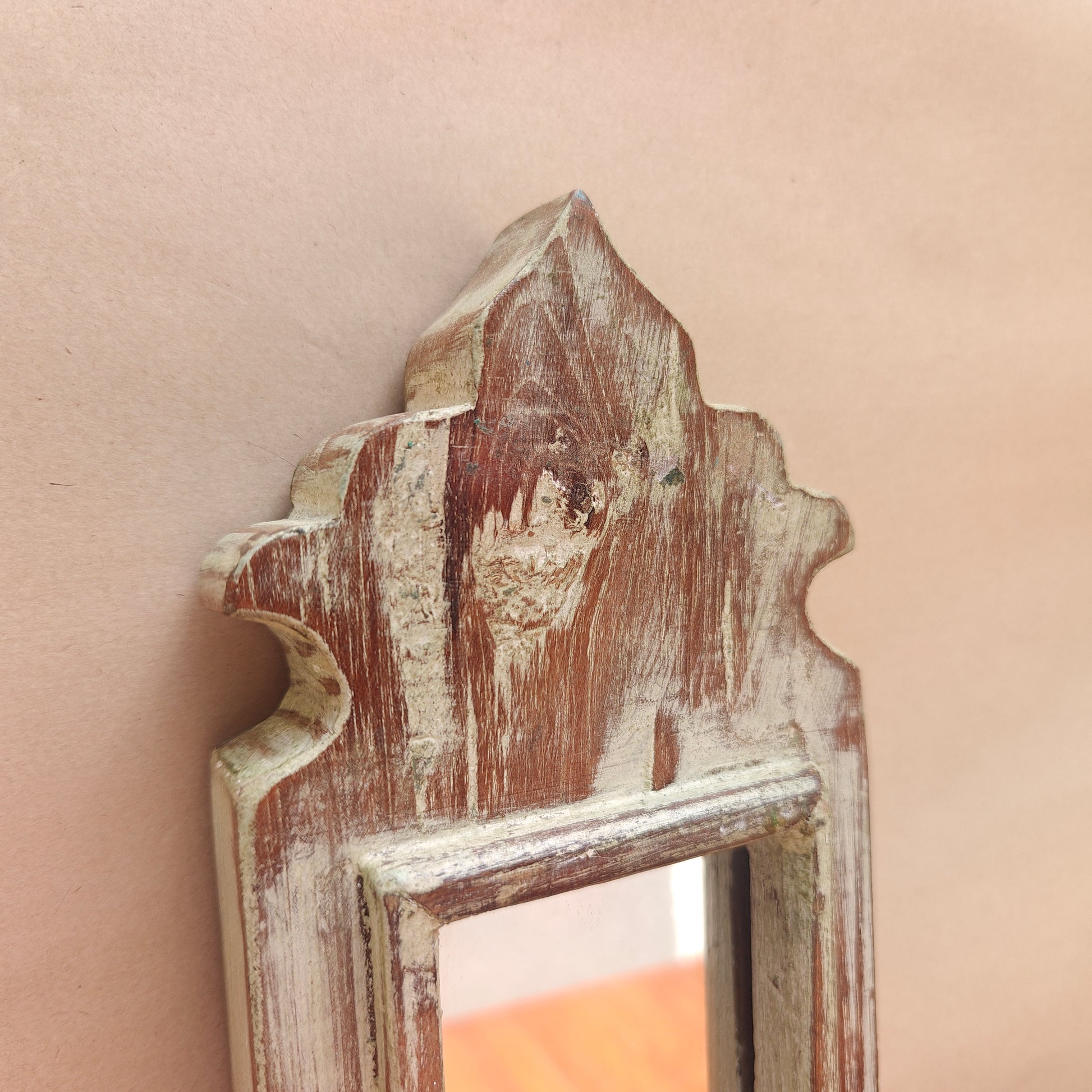 Side profile of narrow vintage whitewash mirror showing frame depth