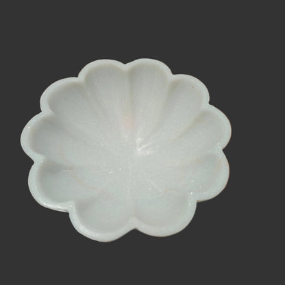 White marble flower bowl close up hand-carved petal ridges Rajasthan