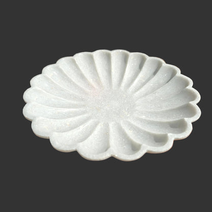 White marble scalloped plate close up hand-carved ridges Rajasthan